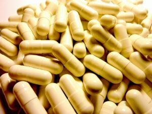 A close-up of serrapeptase capsules, representing the enzyme’s potential to support blood sugar regulation and inflammation reduction during menopause.